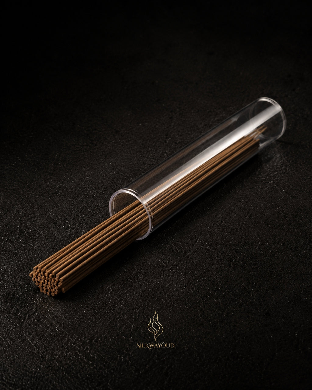 Close-up of thick oud incense stick showing resin-rich agarwood texture